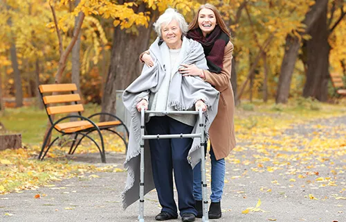 A woman and an older person in the park