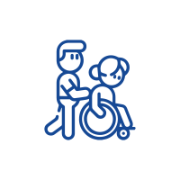 A person in a wheel chair with another person.