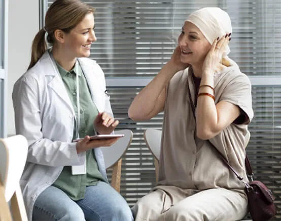 A woman with a bandaged head talking to a doctor.