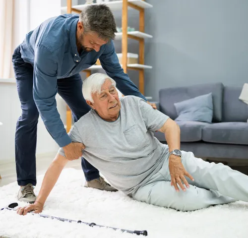 A man helping an older person with his back.