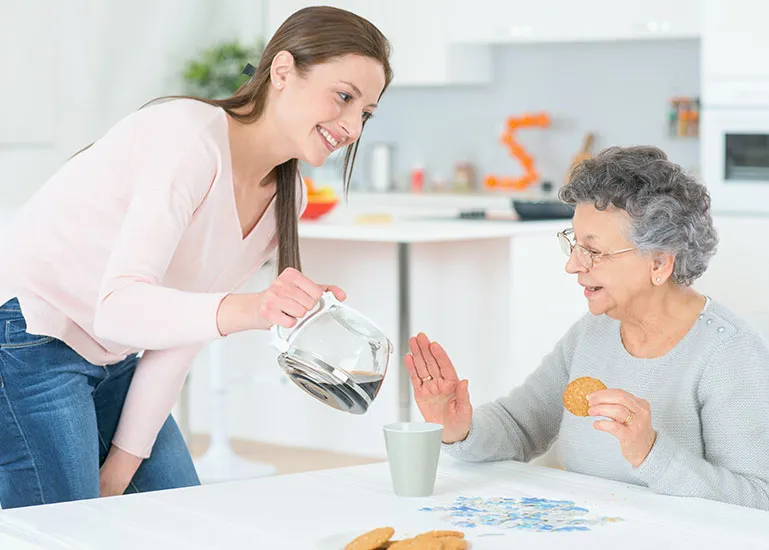 A woman and an older person at a table